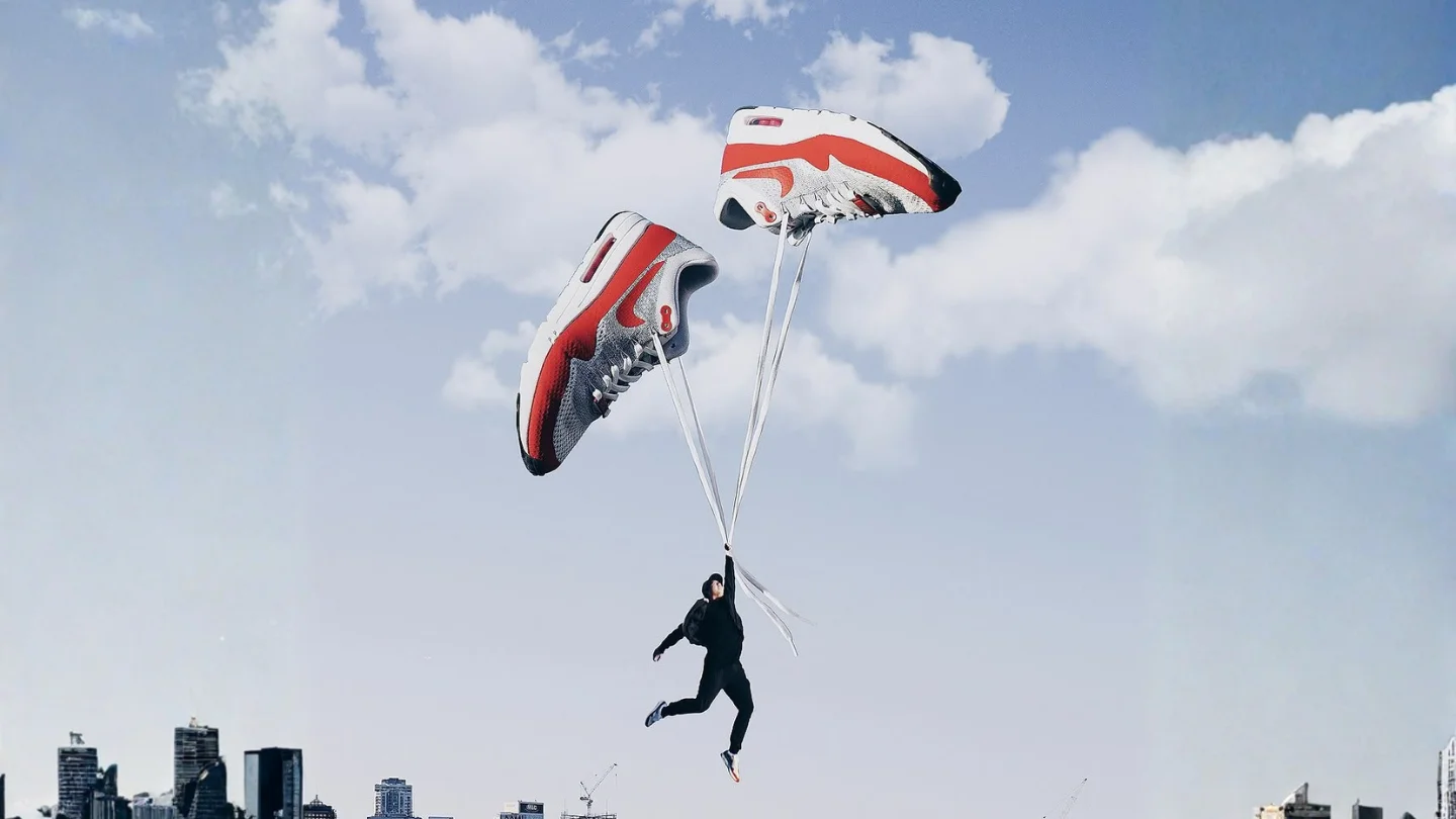 Trainers floating like parachutes above a city skyline, representing product and campaign shoots at Growth Yogi